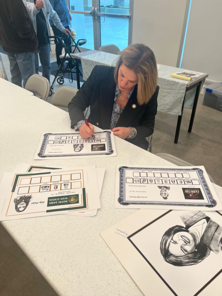 Mayor of Riverside signing the certificate